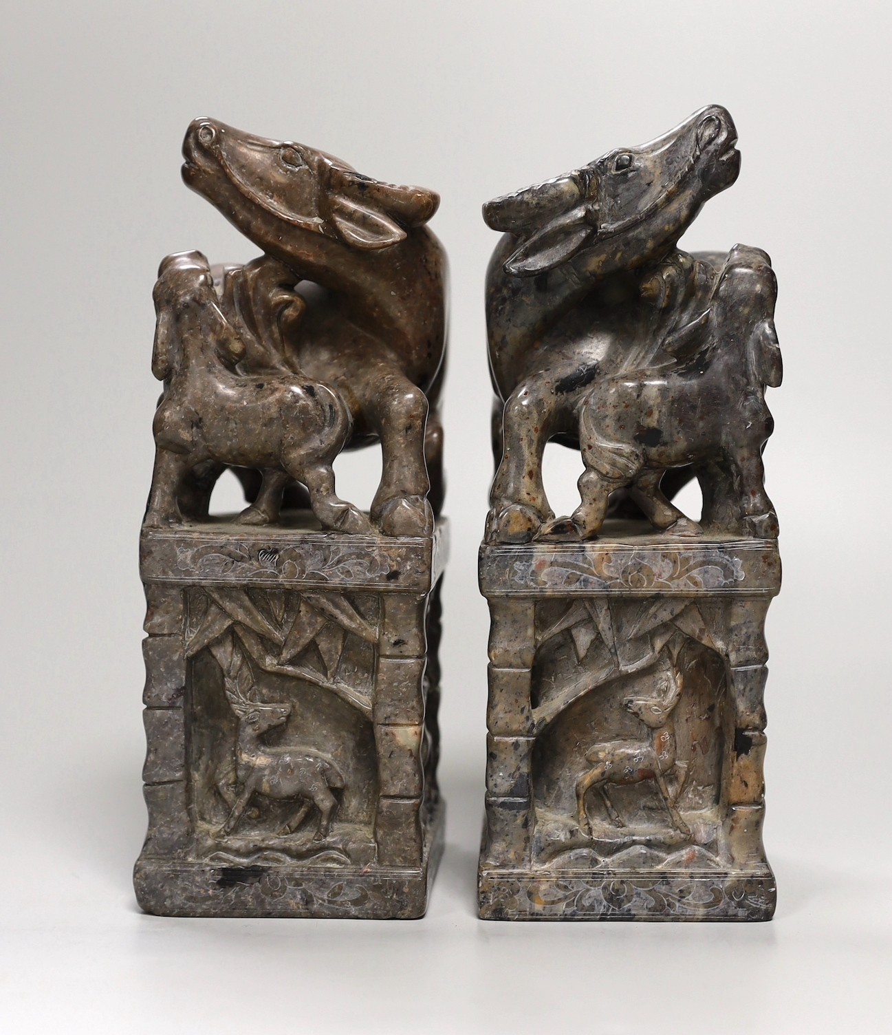 A pair of large Chinese soapstone 'buffalo' seals, 21cm